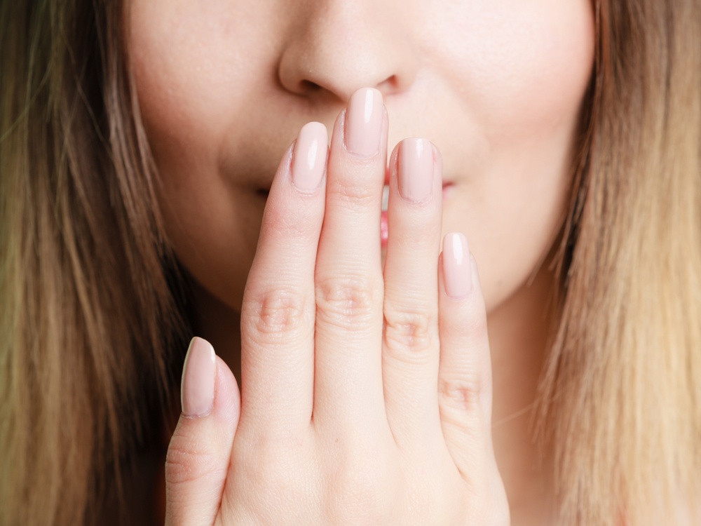 Healthstories-woman-mouth-hand