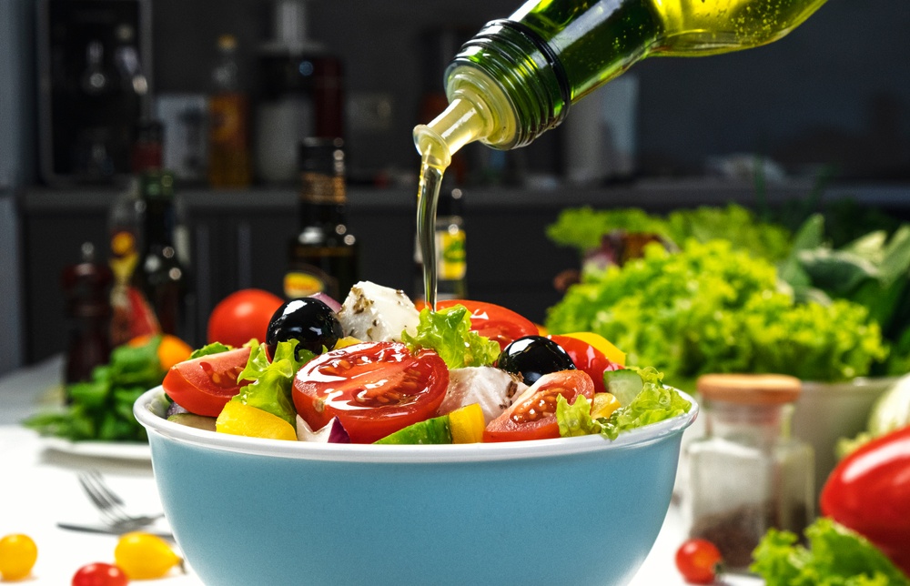 Pouring,Olive,Oil,On,Fresh,Vegetable,Salad,,Mediterranean,Cuisine,,Greek elaiolado